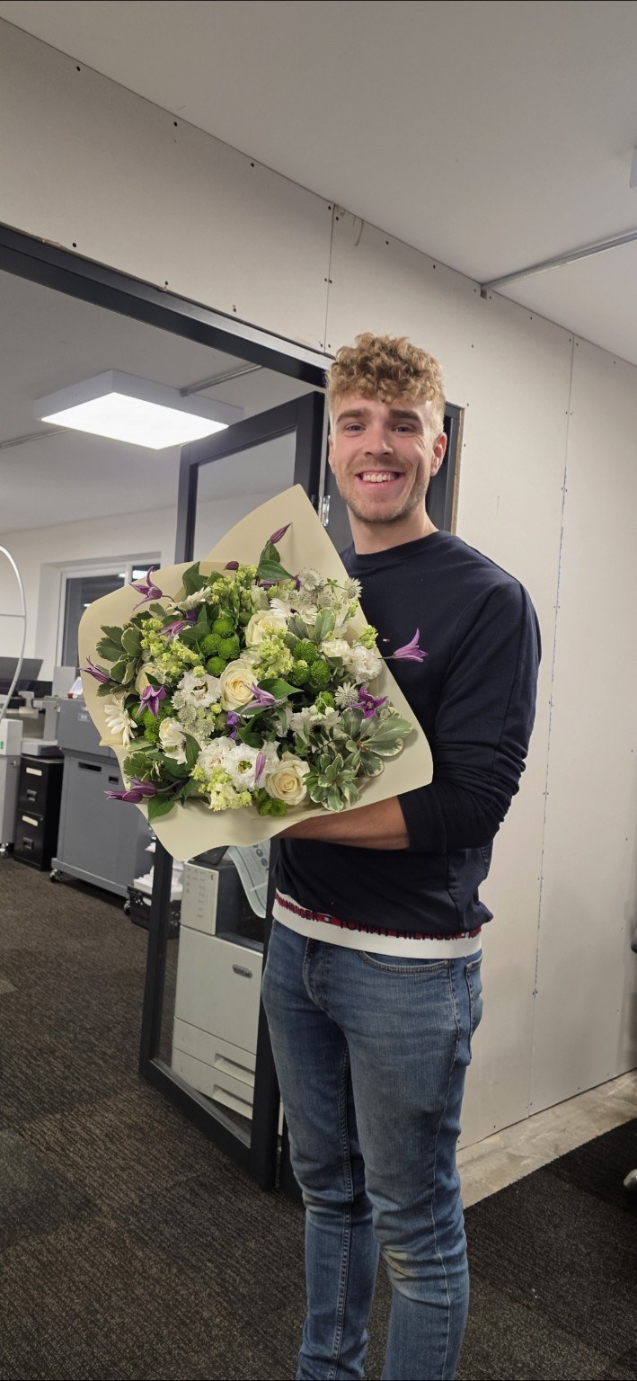 Kieran holding a bouquet